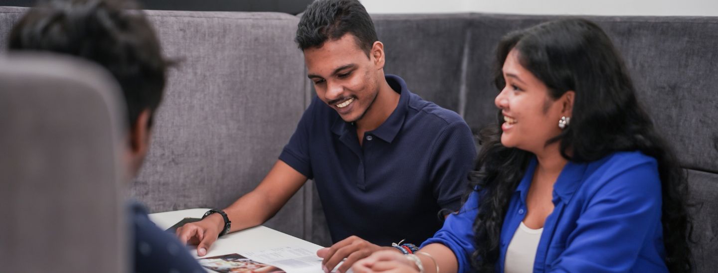 Student sitting and reading book in the calssroom