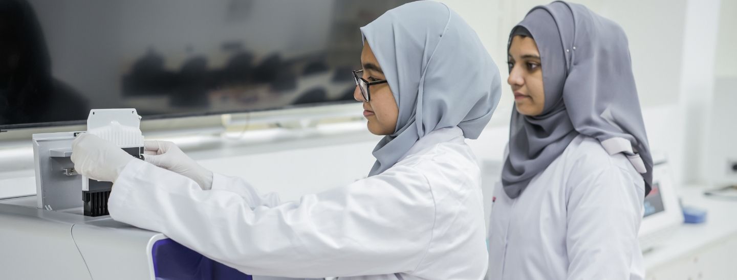 Female students in the science lab