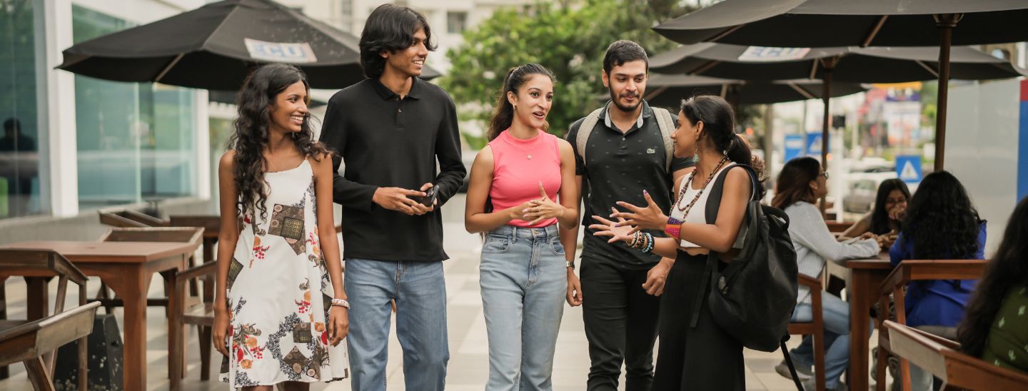 Students talking outside in the campus
