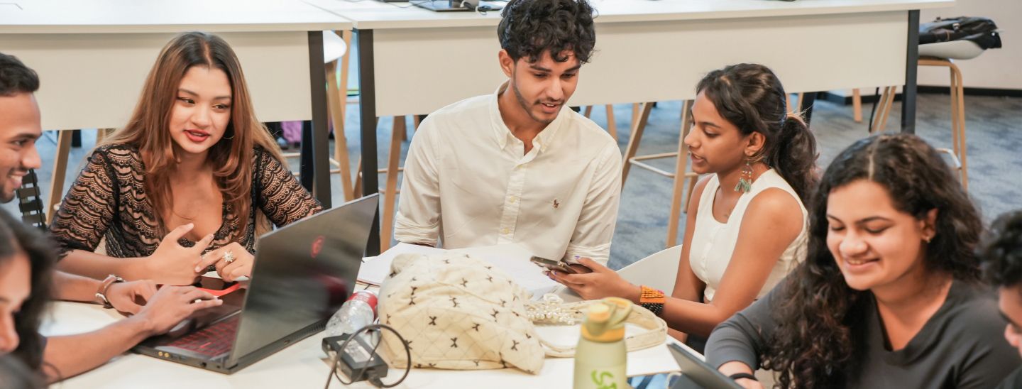 Students group sitting and watching in mobiles