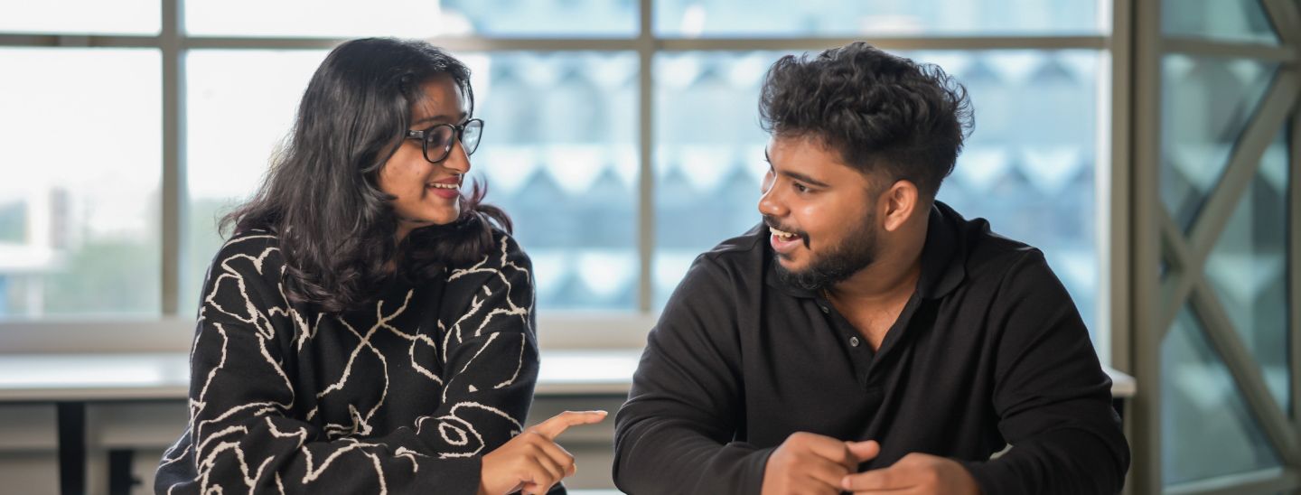 Students sitting and talking in the campus