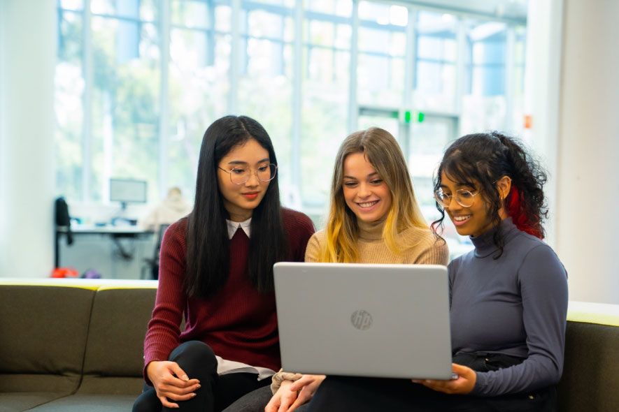 Female students inside studying together