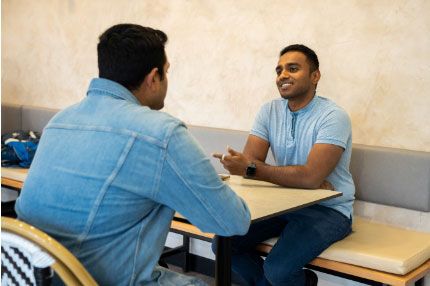 Male students talking inside