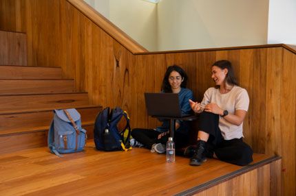 Students sitting inside campus