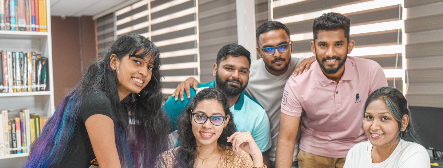 Students sitting inside library together